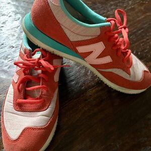 New Balance 620 sneakers in a red and turquoise